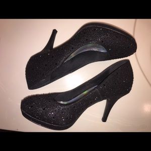 Silver Slipper Black heels that are a women’s 7.5.